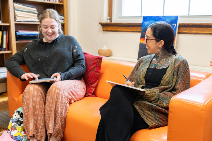 Professor and student talking in office