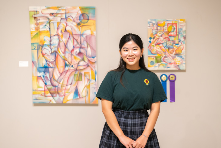 Chi Nguyen with her painting