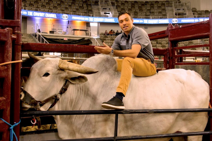 Student reporter on a bull