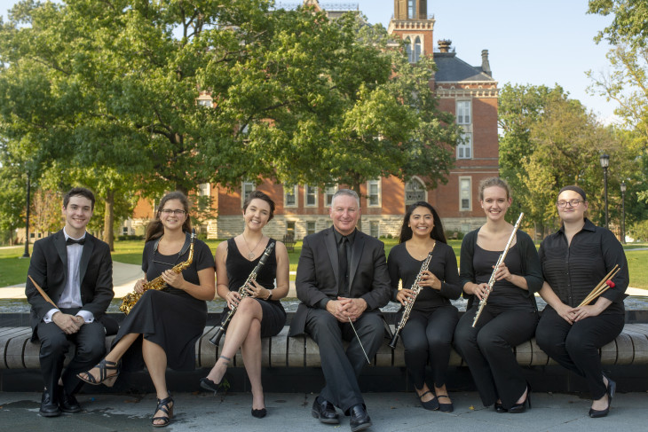 Senior wind musicians pictured with director of bands