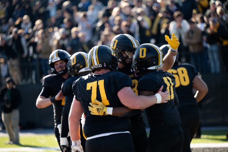 DePauw football players celebrate