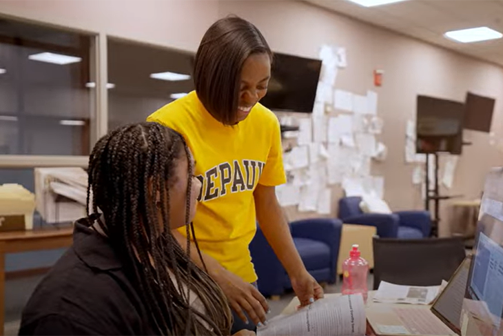 Three students in the news room