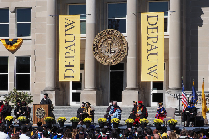 Students, staff, and faculty in front of the Emison building during commencement