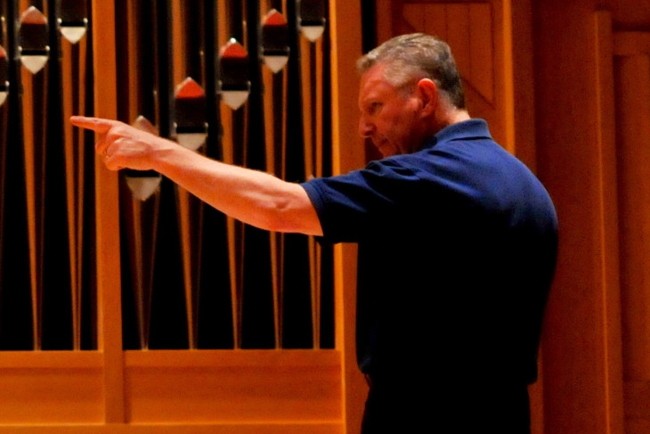 Craig Pare conducts music ensemble