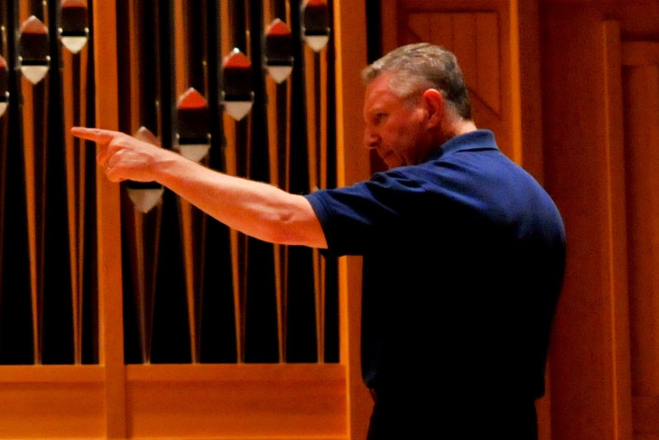 Craig Pare conducts music ensemble