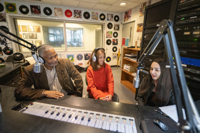 Lori S. White, Tony, and a student the radio booth at WGRE